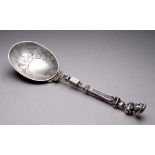 A Dutch silver travelling spoon/fork - the bowl engraved with foliage and detaches from folding fork