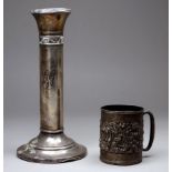 A silver christening mug - Birmingham 1910, William Henry Sparrow, repousse decorated with