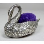A silver pin cushion modelled as a swan - Birmingham 1907, Adie & Lovekin Ltd, width 7cm.