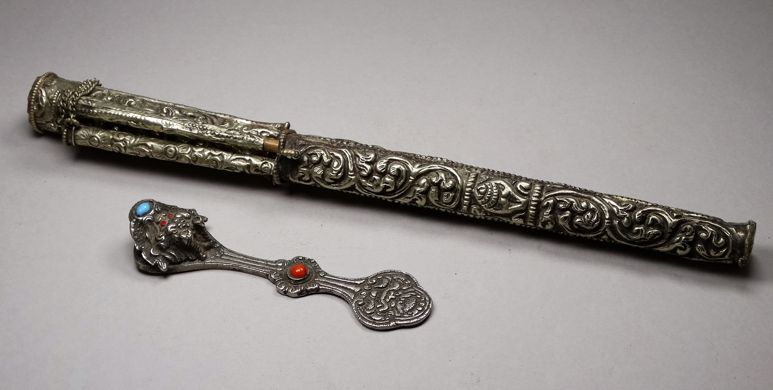 A white metal knife and chopsticks set - repousse decorated with dragons and flowers, length 30cm, - Image 2 of 21