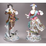 A pair of 19th century Samson figures - shepherdess and galant, the gentleman in a gold floral coat,