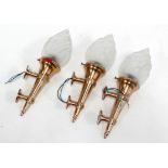 Three late 20th century brass torchere wall lights - with twin fixings and frosted clear glass