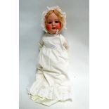 A Dressel 'Jutta - Baby' bisque-headed doll - number 1922, blue sleep eyes and open mouth, with a