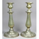 A pair of silver plated candlesticks - height 26.5cm.