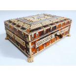 A late 19th century Visakhapatnam tortoiseshell and bone box - rectangular and raised on pad feet,