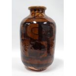 A late 20th century studio pottery vase - with broad body and narrow neck, glazed with geometric