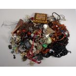 A quantity of costume jewellery - to include hat pins and a large paste set brooch with graduated