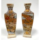 A pair of early 20th century Japanese Satsuma vases - of square baluster form and gilt decorated