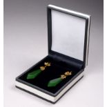 A pair of jade ear pendants - dagger shaped with a floral setting in yellow metal, weight 6.4g.