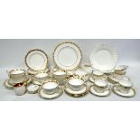 A Wedgwood part dinner service - 'Whitehall' pattern comprising five cups, four saucers, seven