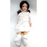 An Armand Marseille 390 child doll - with brown sleep eyes, brown mohair wig, jointed composition