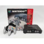 Nintendo 64 games console - with original packaging, controller and F1 World Grand Prix game.