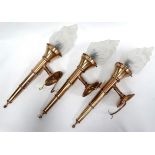 Three late 20th century brass torchere wall lights - with frosted clear glass flambe shades,