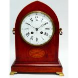 A late 19th century mahogany mantel clock - the lancet case with inlay, twin drop handles and raised