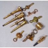 A small quantity of 19th and early 20th century gilt metal fobs and watch keys - one in the form