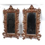 A pair of late 19th century gilt metal girandoles - with rectangular bevelled plates, the frames