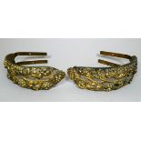 A pair of 20th century curtain tie-backs - cast with grapes and foliage, width 20cm (2).