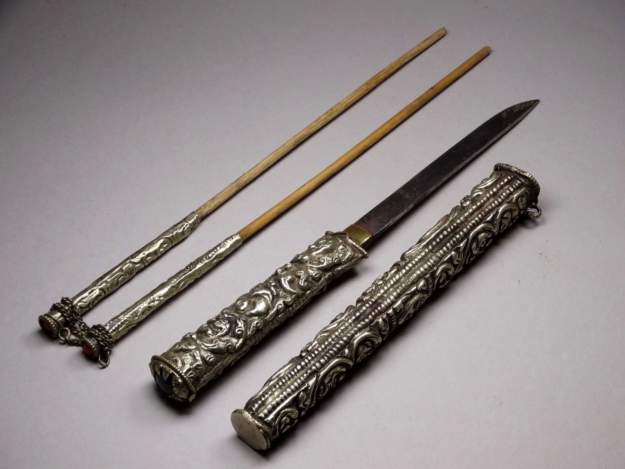 A white metal knife and chopsticks set - repousse decorated with dragons and flowers, length 30cm, - Image 19 of 21