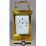 An early 20th century repeating carriage clock - with brass corniche case and bevelled glass plates,