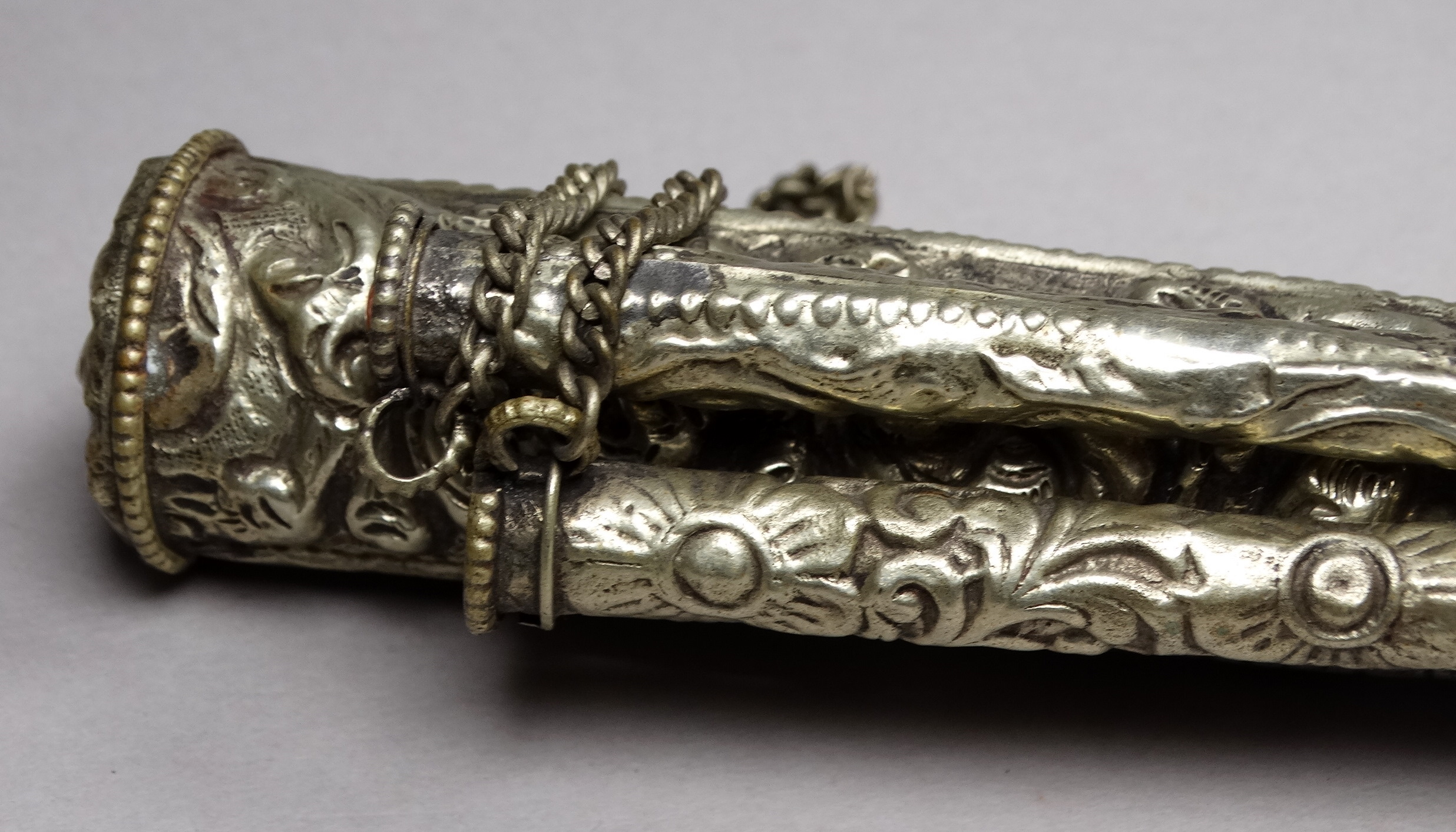 A white metal knife and chopsticks set - repousse decorated with dragons and flowers, length 30cm, - Image 5 of 21