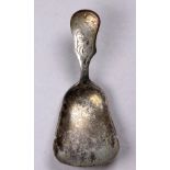An early 20th century white metal Dutch caddy spoon - bearing purity marks, with a foliate