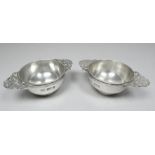 A pair of silver quaichs - London 1902, Fenton, Russell & Co Ltd, each width 7.8cm, weight 75.3g.