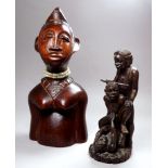 An African hardwood bust of a woman - with bone necklace and decorative features, height 26cm,