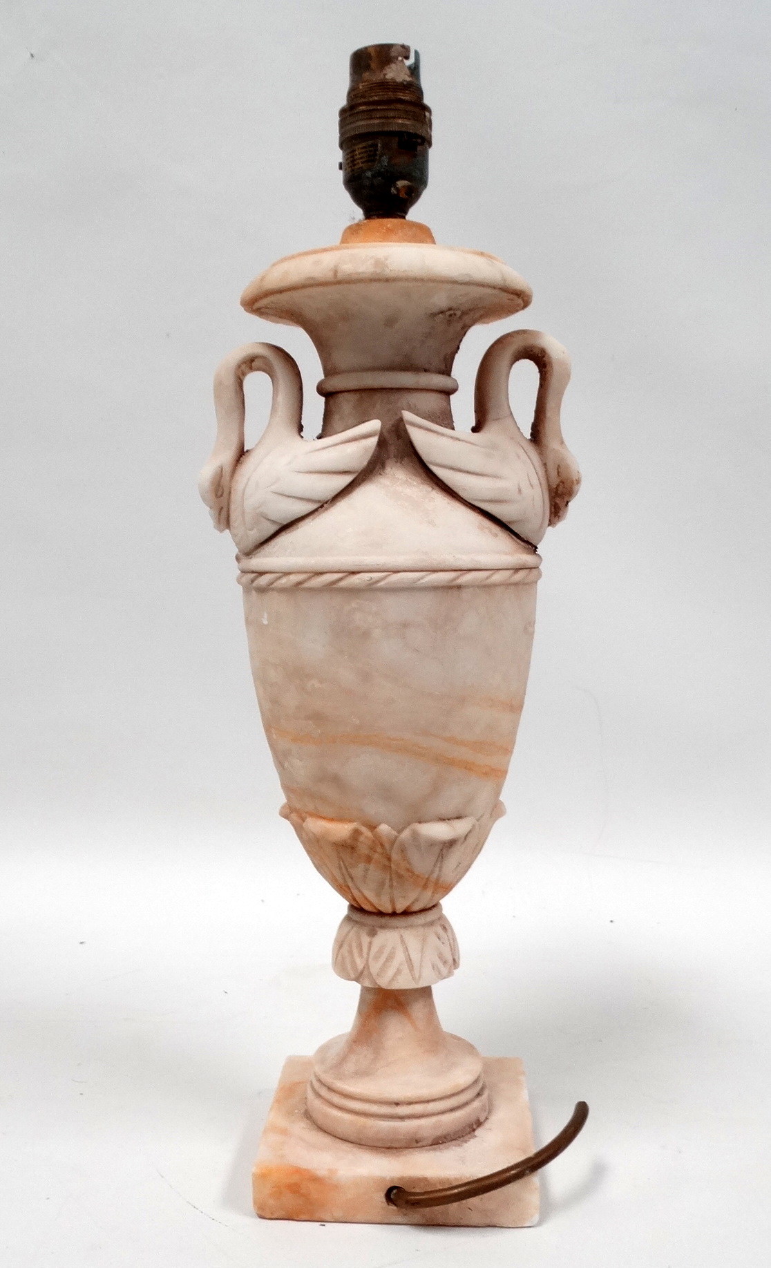 An early 20th century alabaster table lamp - of baluster form and swan shaped twin handles, height