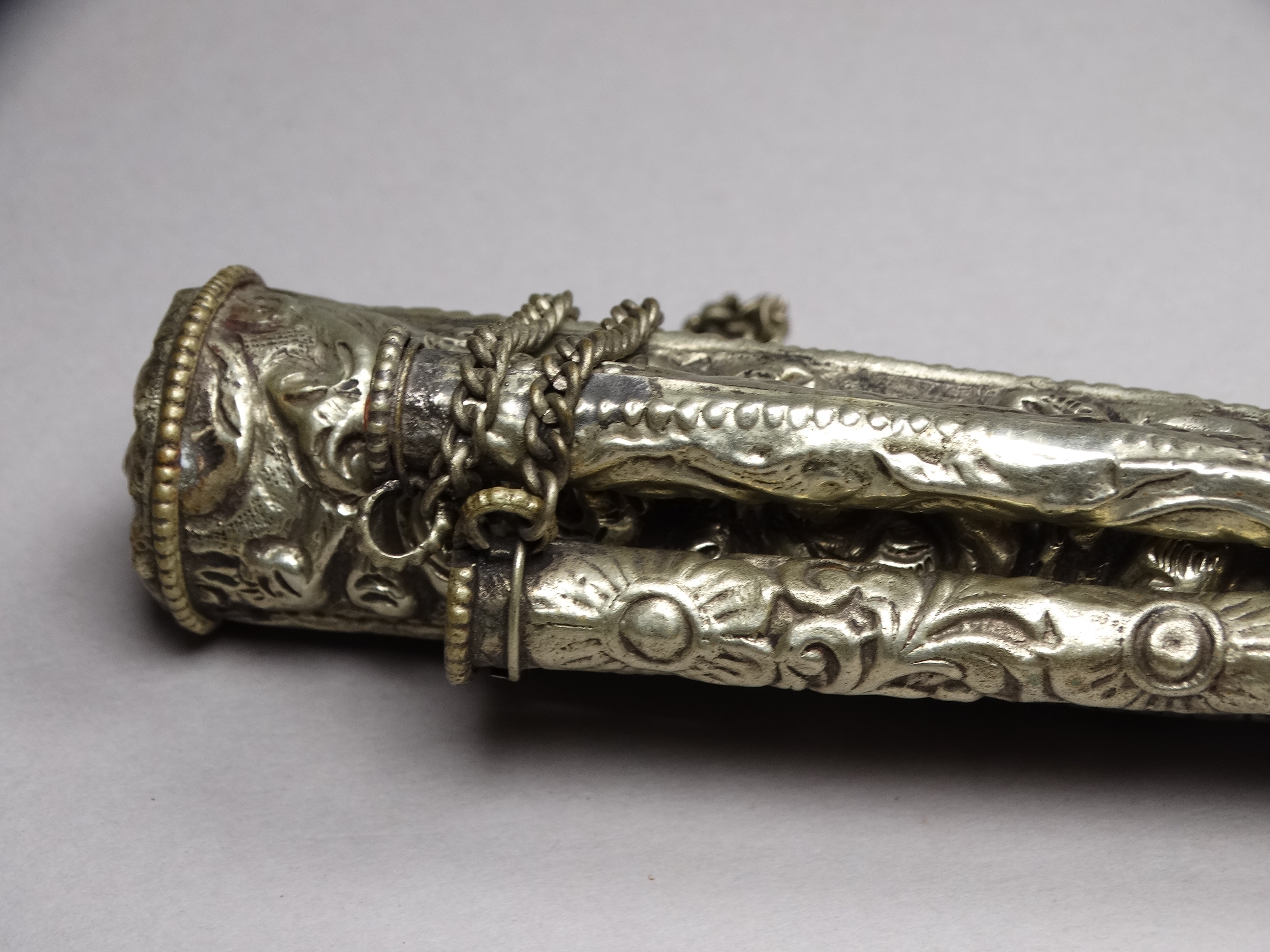 A white metal knife and chopsticks set - repousse decorated with dragons and flowers, length 30cm, - Image 4 of 21