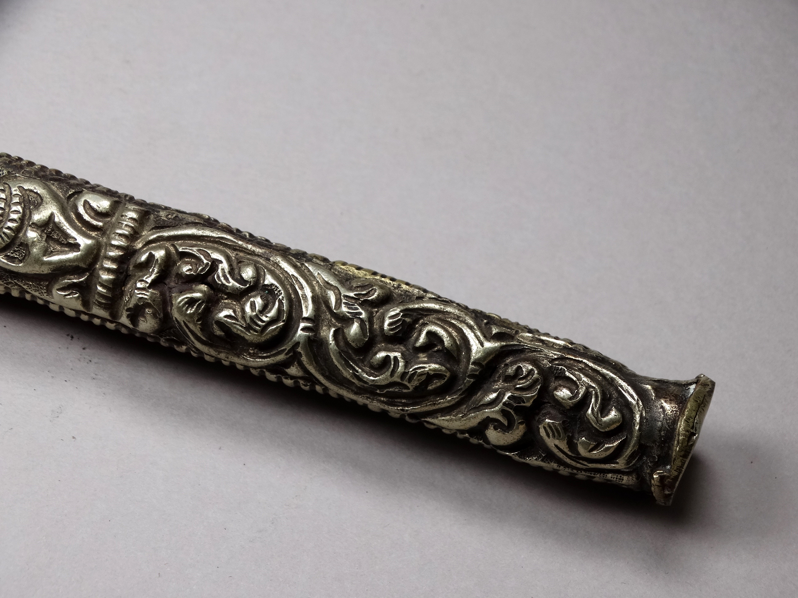 A white metal knife and chopsticks set - repousse decorated with dragons and flowers, length 30cm, - Image 9 of 21