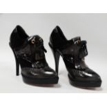 Gucci - a pair of black leather, patent leather and suede stiletto heeled shoes with gold tone