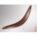 An early 20th century Australian Aboriginal hardwood boomerang - width 57cm.