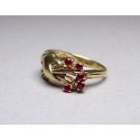 A diamond and gem set 14ct yellow gold ring - moulded as a hand with flowers, size P, 5g
