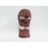 An early 20th century Songye carved hardwood mask - polychrome painted in white and terracotta,