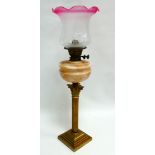 A late 19th century brass and glass oil lamp - with marbled reservoir and pink trimmed etched
