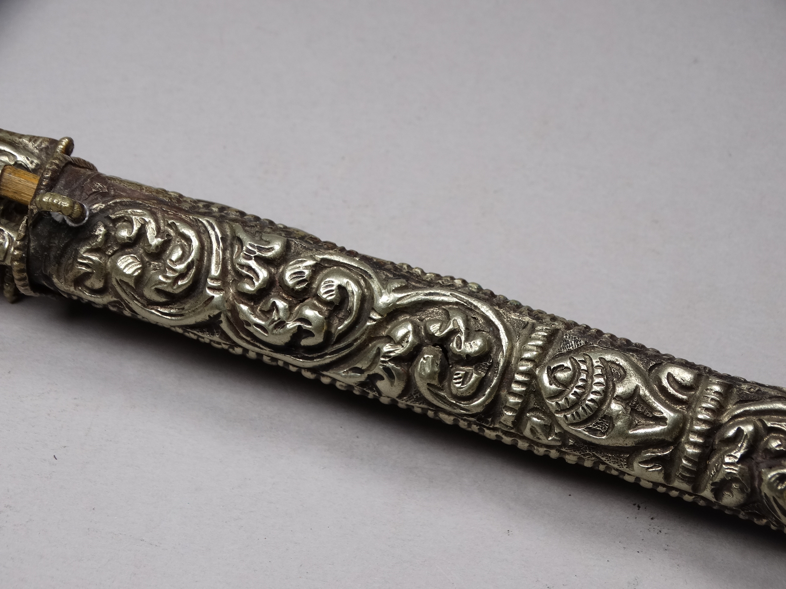 A white metal knife and chopsticks set - repousse decorated with dragons and flowers, length 30cm, - Image 6 of 21