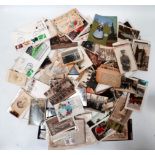 A small quantity of interesting ephemera - including stamps, first day covers, post cards,