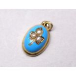 An early 20th century continental yellow metal pendant - possibly 18ct, turquoise enamel set with