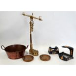A set of early 20th century brass balance scales - cylindrical weights incorporated in the foot,