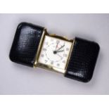 A Mavado travelling alarm purse watch - of typical sliding rectangular form with a simulated