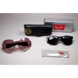 A pair of Wayfarer style fashion sunglasses - with case and outer box, together with another pair of