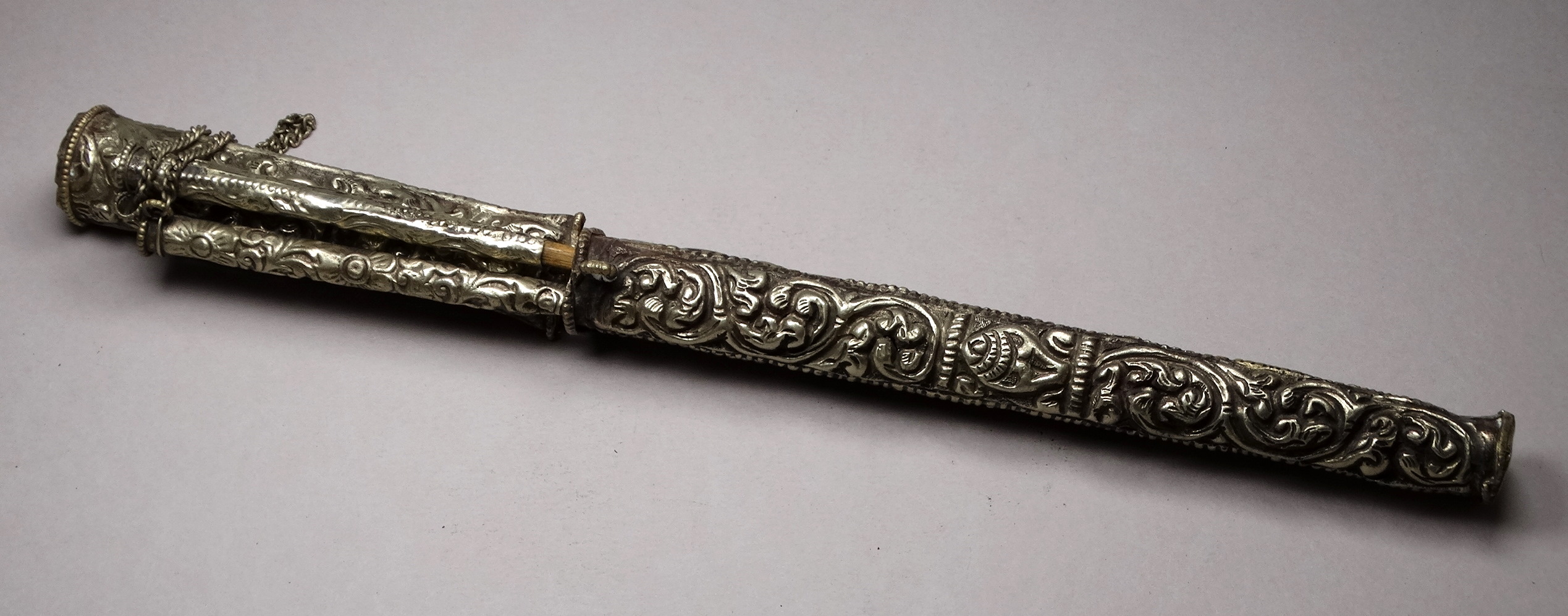 A white metal knife and chopsticks set - repousse decorated with dragons and flowers, length 30cm, - Image 11 of 21