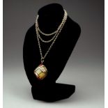 A mother of pearl and gem stone pendant - set within a 14ct yellow gold frame, on a 9ct yellow