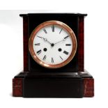 A late 19th century black slate and rouge marble mantel clock - the white enamel dial set out with