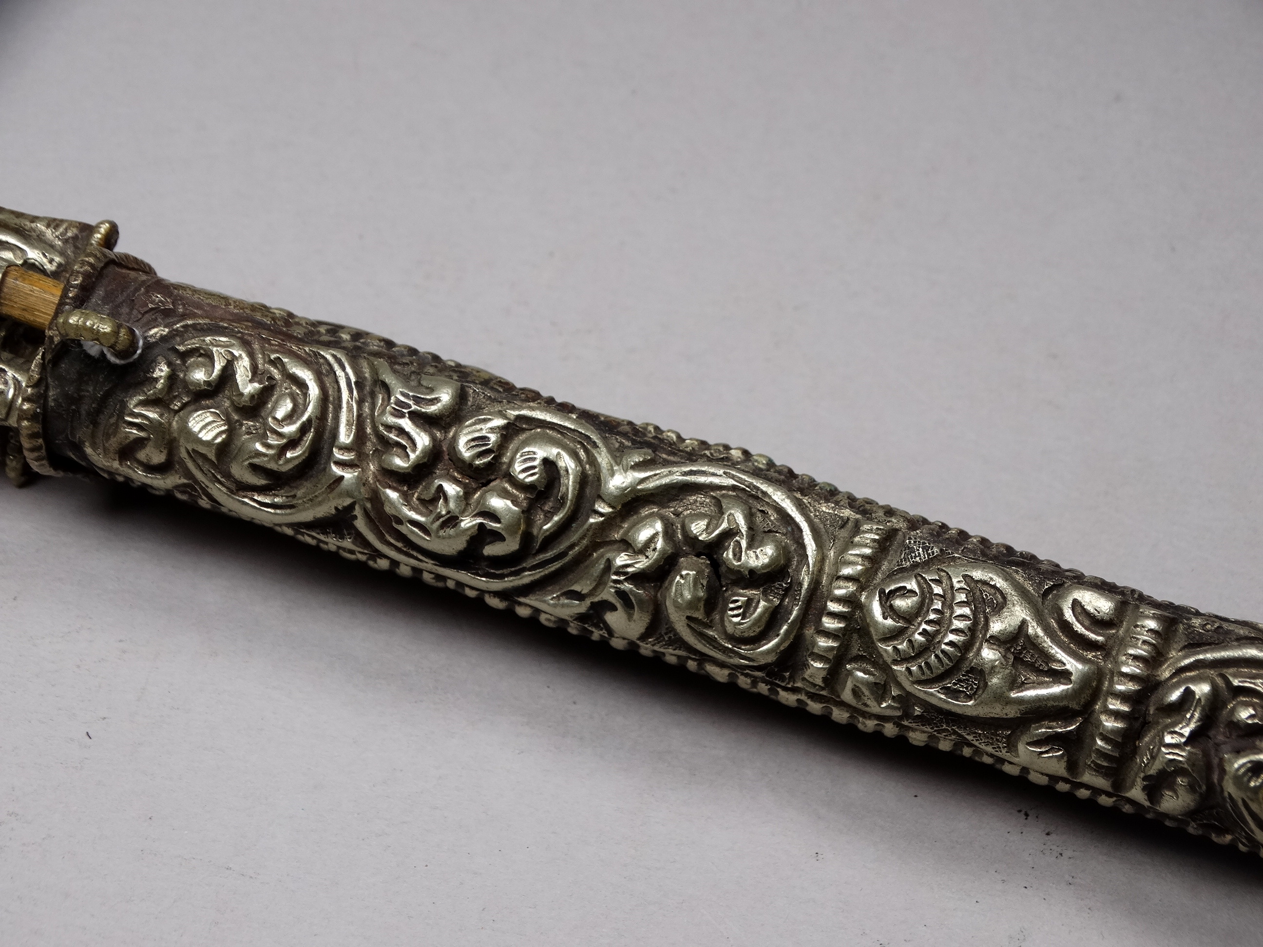 A white metal knife and chopsticks set - repousse decorated with dragons and flowers, length 30cm, - Image 7 of 21