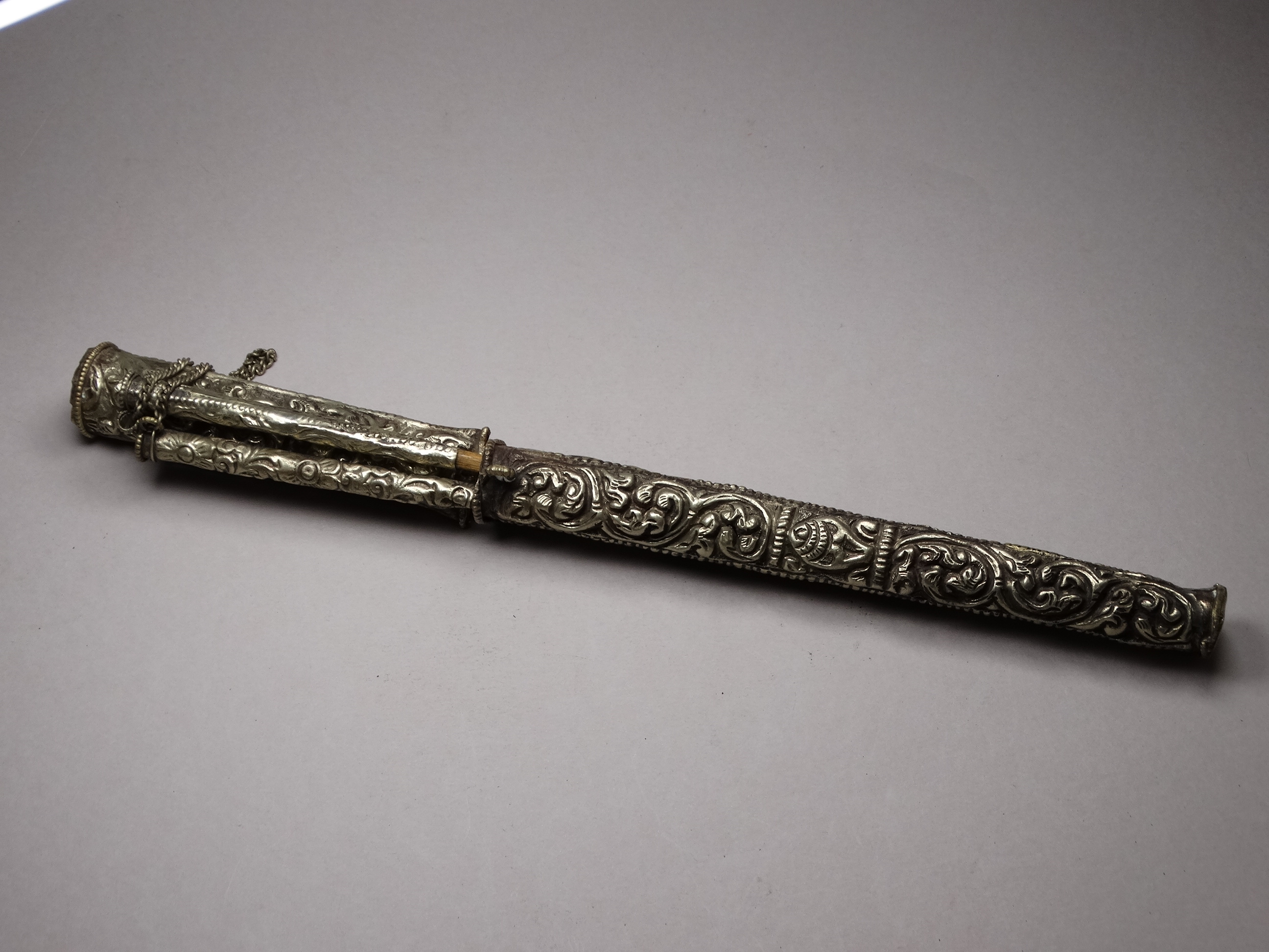 A white metal knife and chopsticks set - repousse decorated with dragons and flowers, length 30cm, - Image 10 of 21