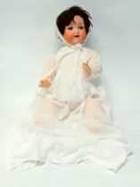 A 20th century Armand Marseille bisque head doll - with blue sleeping eyes, open mouth with teeth