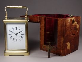 A 20th century carriage clock - the corniche case bearing presentation name and with a white