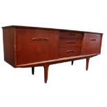 A teak sideboard circa 1970 - with an arrangement of three drawers, including a cutlery drawer,