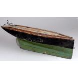 An early 20th century scratch built pond yacht hull - black and green below the waterline, with a